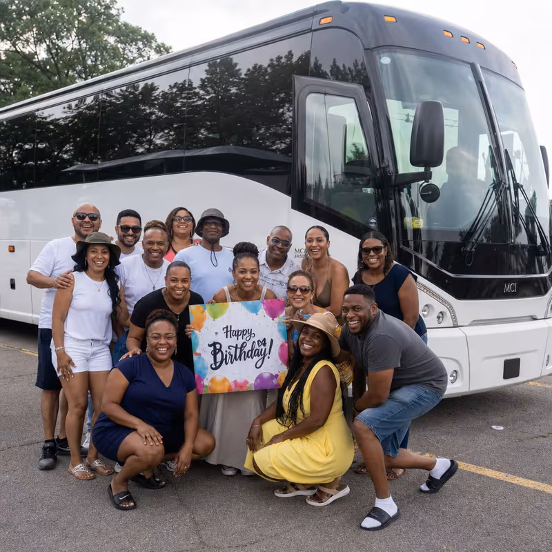 Passengers loading luggage while boarding an New Orleans group shuttle