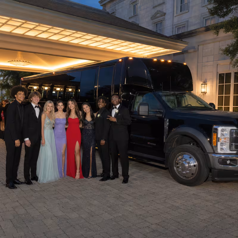Party bus interior with wraparound leather seating and LED lighting in New Orleans