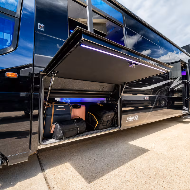 Party bus interior with wraparound leather seating and LED lighting in New Orleans