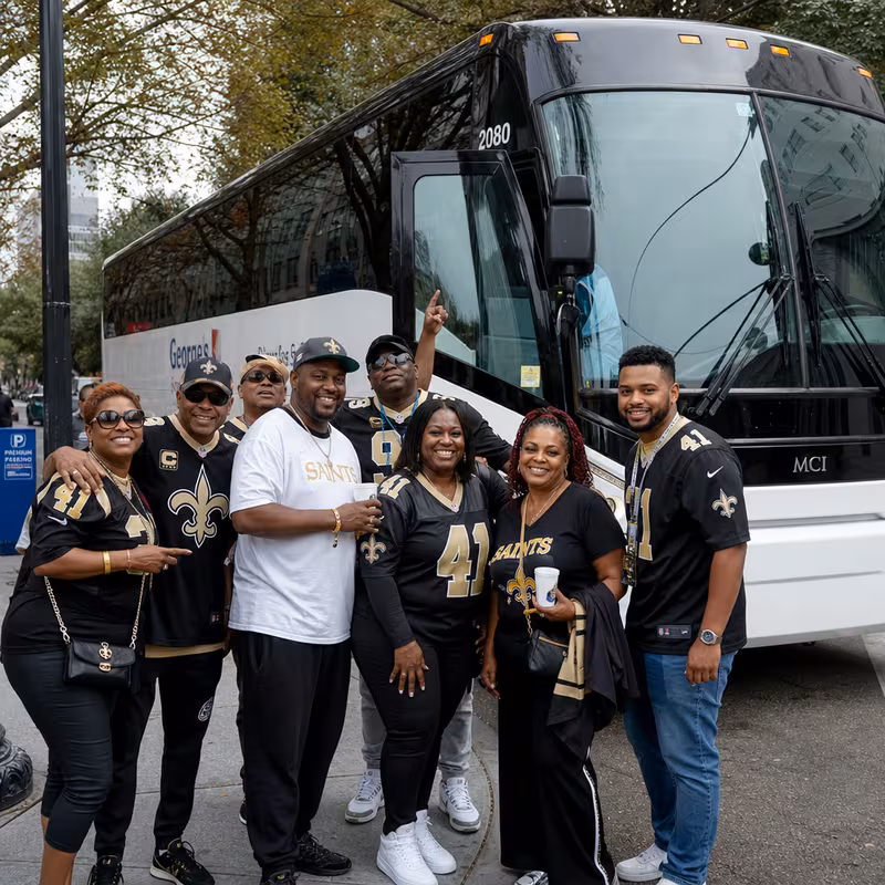 Passengers loading luggage while boarding an New Orleans group shuttle